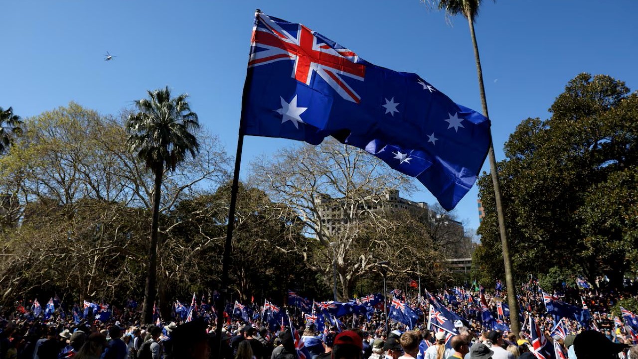 Demonstrators carry Australian flags during anti-immigration rally, in Sydney, Australia, August 31, 2025–Reuters